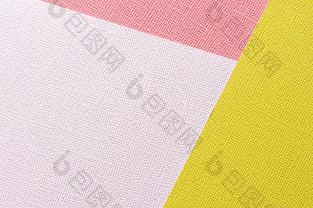 黄色、粉色、红色抽象纸背景。纸张纹理