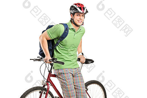 摄影棚拍摄了一个背着背包和自行车的年轻人