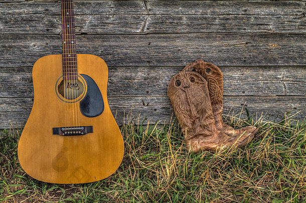 阿库蒂克吉他牛仔他牛仔靴子岁的农场流墙农村阿尔伯塔省加拿大
