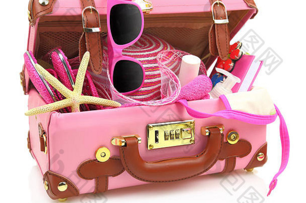 准备旅行的粉红色手提箱，夏季设备隔离