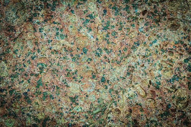 抽象背景。棕绿色垃圾墙石背景或纹理图案固体天然岩石