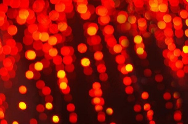 红色模糊花环灯的抽象节日背景