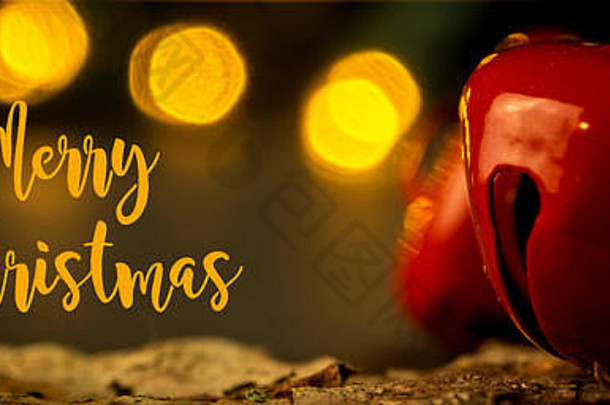 特写镜头圣诞节装饰发出叮当声钟橙色彩色的模糊灯晚上温暖的大气黄昏背景