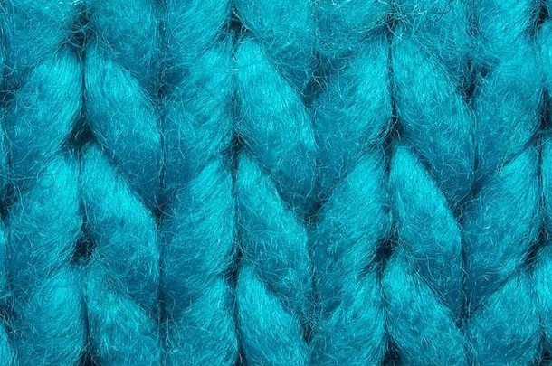 蓝色的针织毛衣纹理宏背景