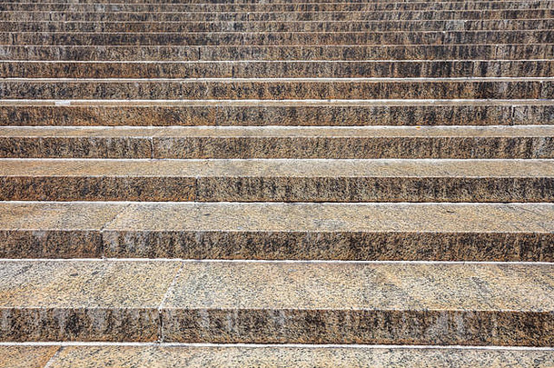 棕色（的）灰色颜色花岗岩楼梯背景纹理固体石头步骤在户外