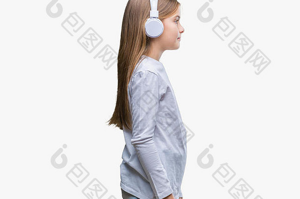 年轻的美丽的女孩穿耳机听音乐孤立的背景一边放松配置文件构成自然脸吐露