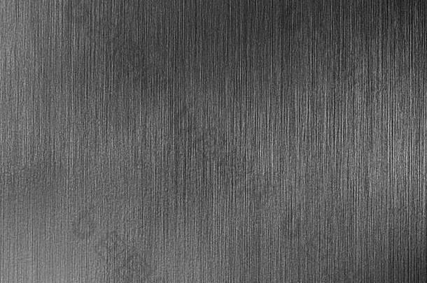 深灰色金属纹理，带有白色划痕。抽象噪声黑色背景叠加设计。艺术风格化的贝纳。
