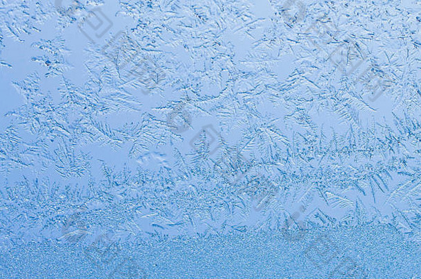 冬季霜冻背景照片，窗户上积冰