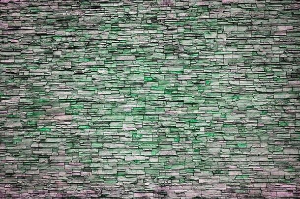 抽象不规则的绿色砖墙图案作为背景或纹理