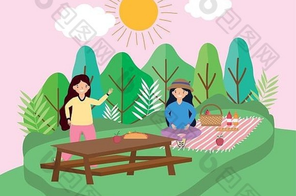 带着桌布的年轻女子在公园野餐