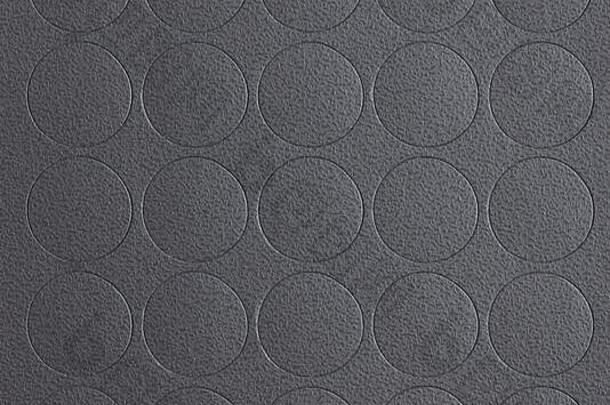 灰色皮革圆形图案背景。灰色圆形网格