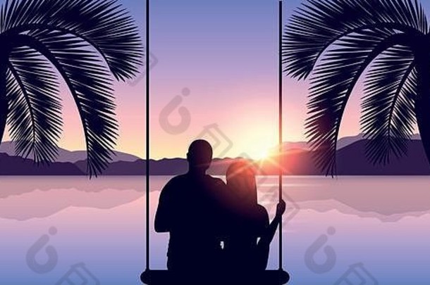 秋千上相爱的情侣在海边两棵棕榈树之间的海滩上欣赏日落