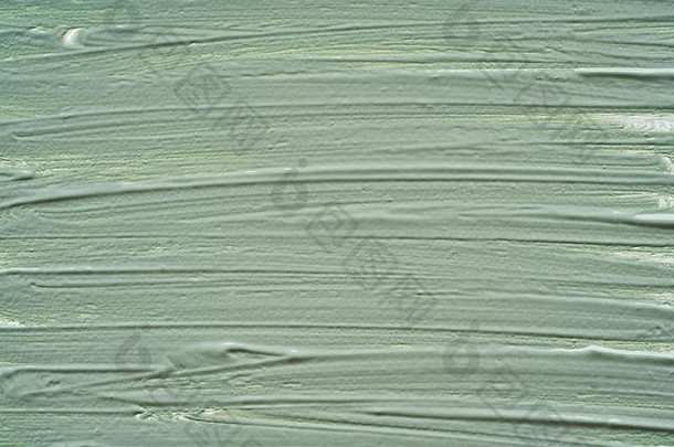 轻轻绿色中风纹理脸奶油丙烯酸油漆孤立的白色背景