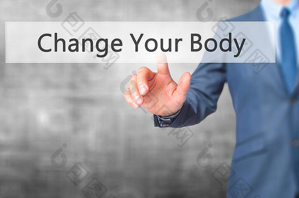 改变你的身体-手按触摸屏界面上的按钮。商业、技术、互联网概念。库存照片