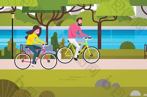 夫妇在公园里骑自行车男女在户外骑自行车