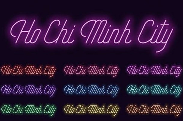 胡志明名字的霓虹字体。胡志明市的霓虹文字。一套带有透明背光的发光文字，用于设计。红粉紫v