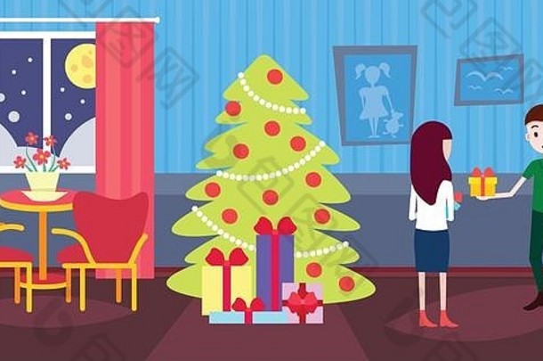 男人。持有礼物盒子现在女人快乐一年快乐圣诞节庆祝活动概念装饰冷杉树生活房间室内水平