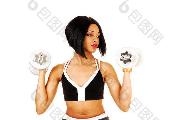 苗条的年轻的女人黑色的锻炼服装工作银颜色哑铃白色背景