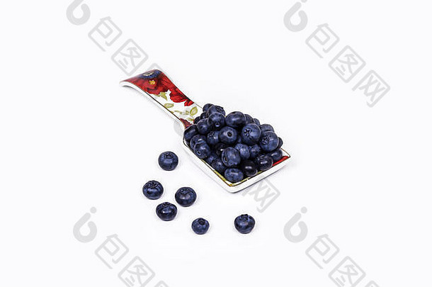光背景谎言瓷勺子大蓝莓浆果