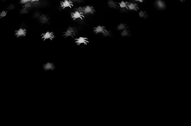 散焦白色蜘蛛轮廓鬼魂黑色的万圣节背景复制空间假期装饰聚会，派对概念