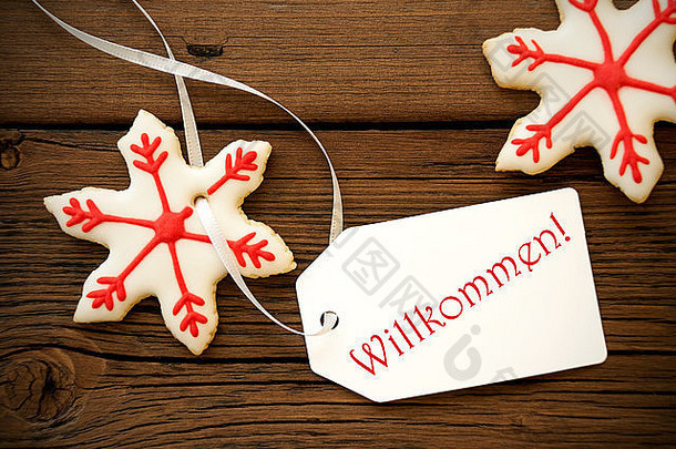 红色的白色圣诞节明星饼干标签站德国词欢迎意味着