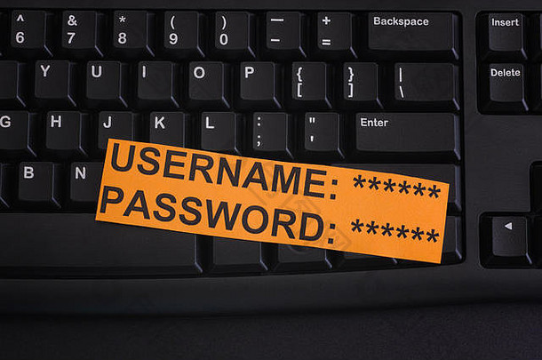 纸请注意用户名密码黑色的电脑键盘互联网安全概念关闭