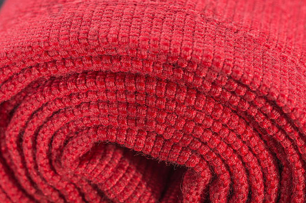 特写镜头极端的宏橙色聚酯材料红色的缝缝比喻滚卷编织织物边缘