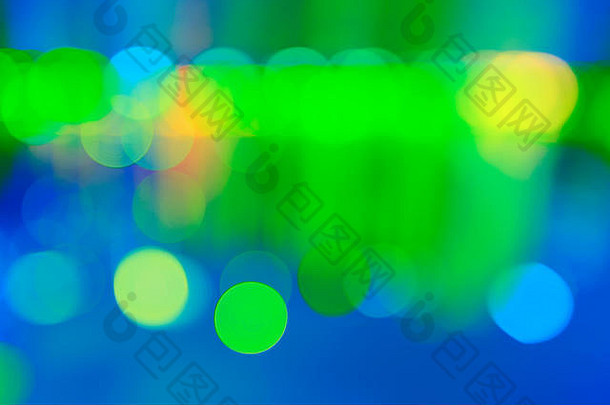 艺术散景背景散焦圆形蓝色的绿色黄色的灯惠特黑色的颜色背景