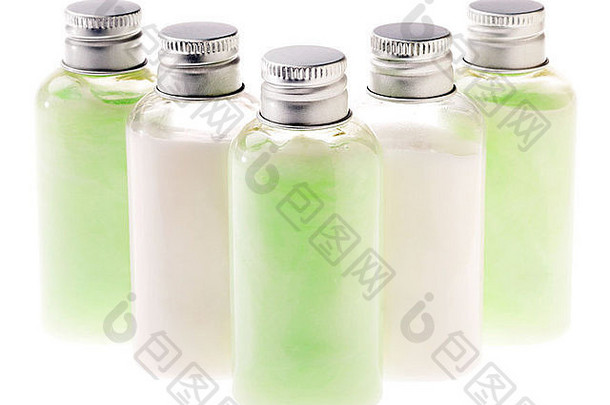 小透明的塑料瓶填满化妆品粉绿色白色乳液密封银金属帽绿色内容瓶