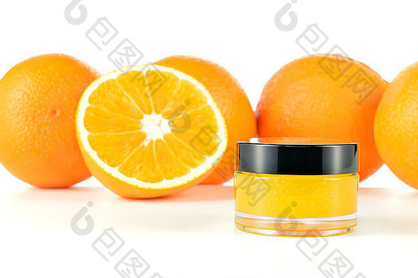 自然橙色糖唇擦洗白色背景橙色化妆品玻璃Jar橙子背景