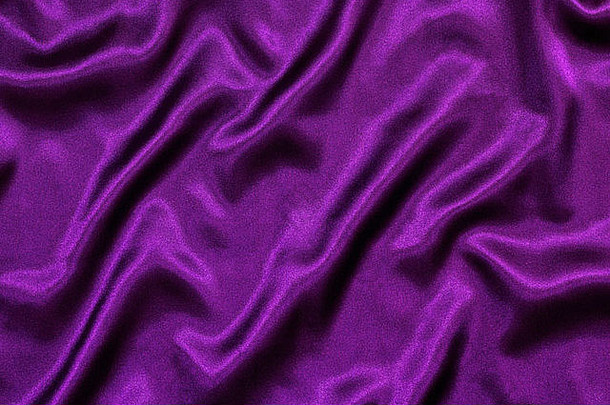 紫色的丝绸背景纹理宽松的折叠使皇家波浪模式