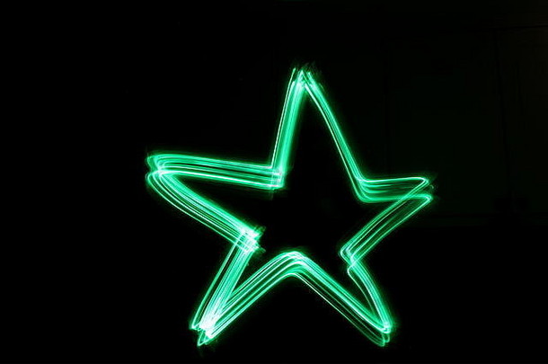 长曝光照片霓虹灯绿色颜色摘要明星大纲形状黑色的背景光绘画摄影摘要颜色