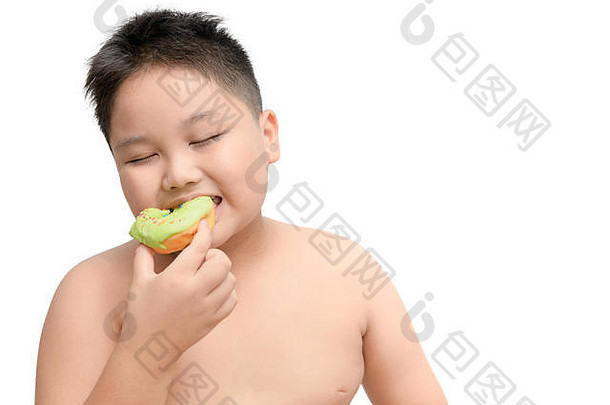 肥胖脂肪男孩享受吃甜甜圈孤立的白色背景垃圾食物节食概念