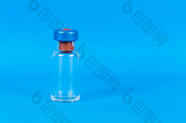 空疫苗瓶孤立的蓝色的背景