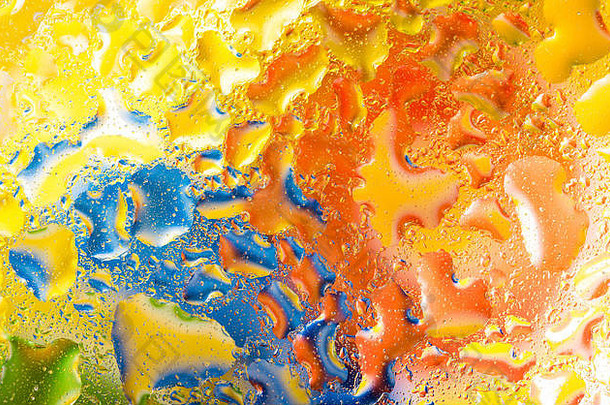 水滴玻璃绿色蓝色的橙色背景色彩斑斓的摘要多雨的壁纸