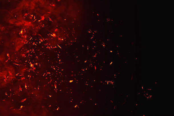 火粒子碎片孤立的黑色的背景文本空间电影纹理效果