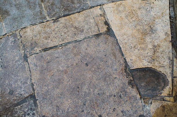 粗糙的石头瓷砖地板上裂缝小石头摘要背景纹理