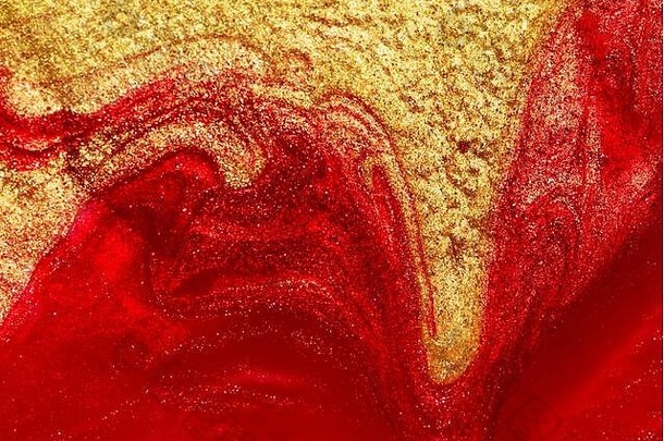 红色的黄金指甲波兰的流体纹理背景