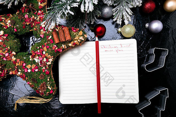 圣诞节菜单计划背景写作圣诞节菜单前视图笔记本黑色的背景装饰
