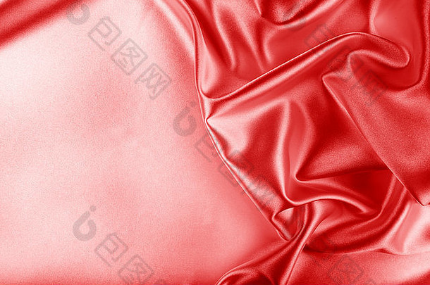 红色的丝绸织物纹理布料摘要背景