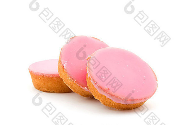 粉红色的上釉饼干堆放孤立的白色背景