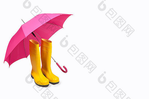 黄色的橡胶靴子粉红色的伞孤立的