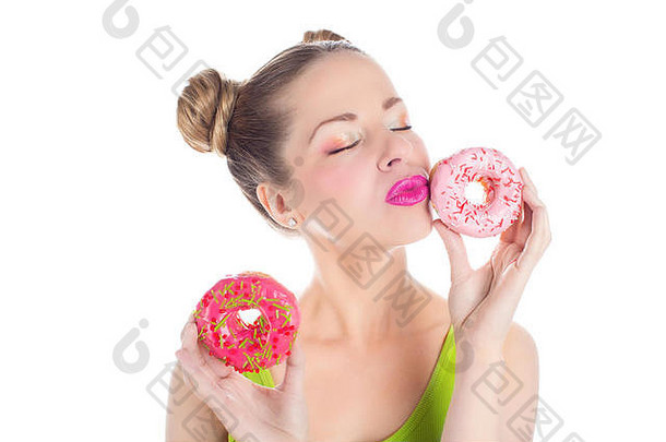 美丽的年轻的女孩明亮的色彩斑斓的甜甜圈