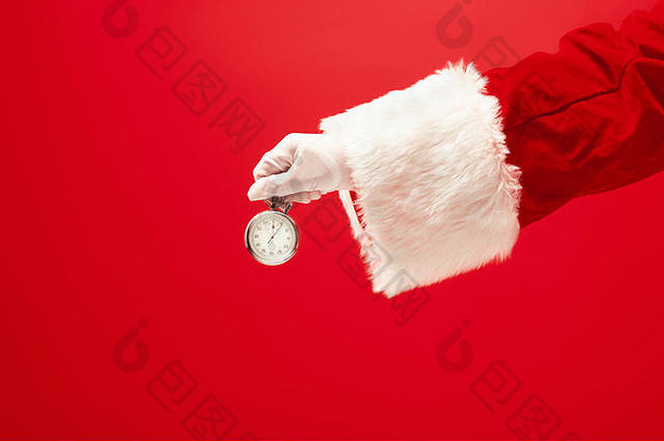 圣诞老人持有秒表红色的背景季节冬天假期庆祝活动礼物概念