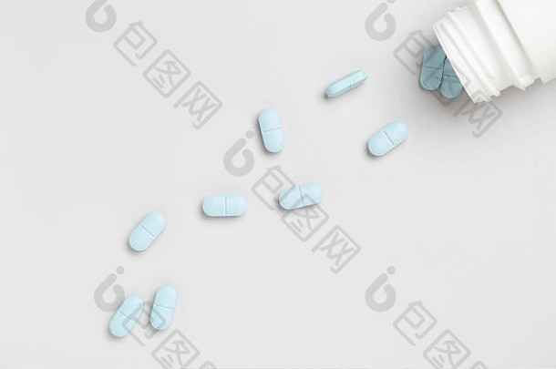 塑料药片<strong>瓶</strong>蓝色的医学药片单颜色背景