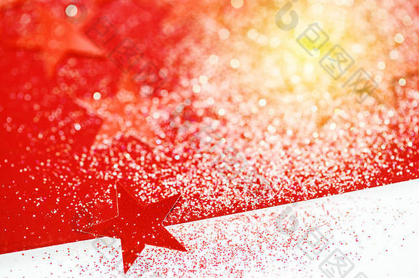 圣诞节背景红色的星星闪光的散景灯伟大的问候文本