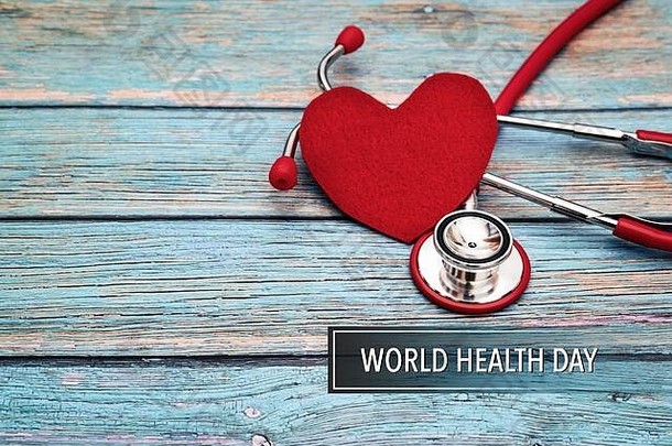世界健康一天医疗保健医疗概念红色的听诊器红色的心蓝色的木背景