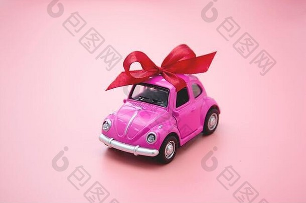 寇比2月微型粉红色的玩具车红色的丝带弓粉红色的背景
